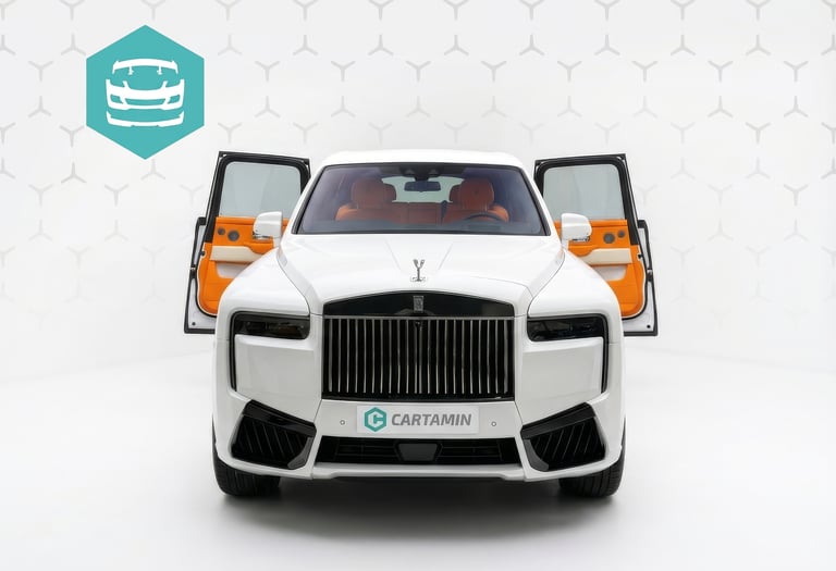 White Rolls-Royce Cullinan luxury SUV with open suicide doors and a bright orange leather interior.