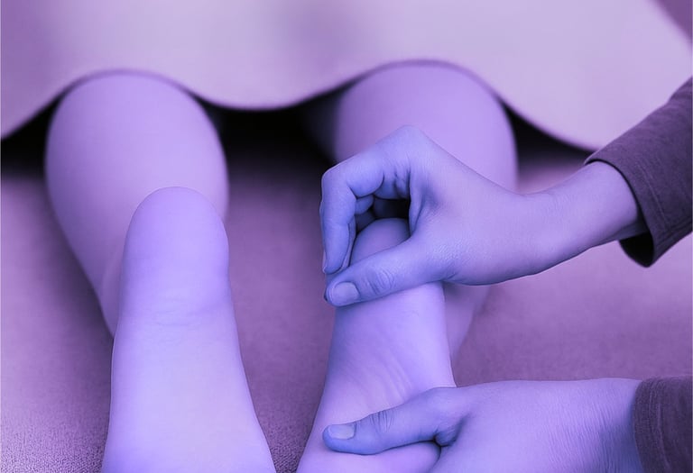 Practitioner’s hands mobilise foot joints, restoring alignment and balance in a calm, nurturing setting.