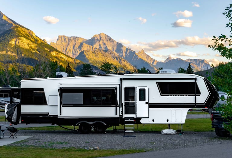 Brinkley RV at Waterton Lakes Campground with mountains in the background.