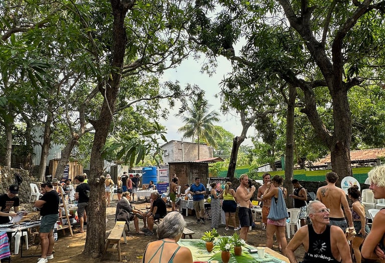 farmers market event with people standing and talking