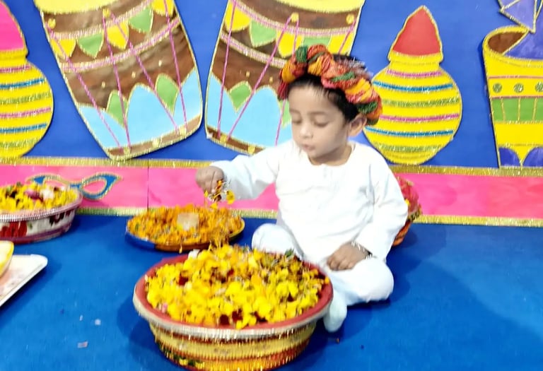 child playing with flower at Enfant pre school Ghaziabad
