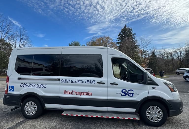 Saint George Trans white non-emergency medical transportation van for handicap accessible patient transport.