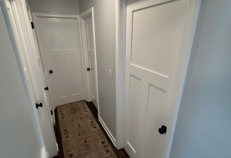 interior residential hallway with fresh white coat of paint