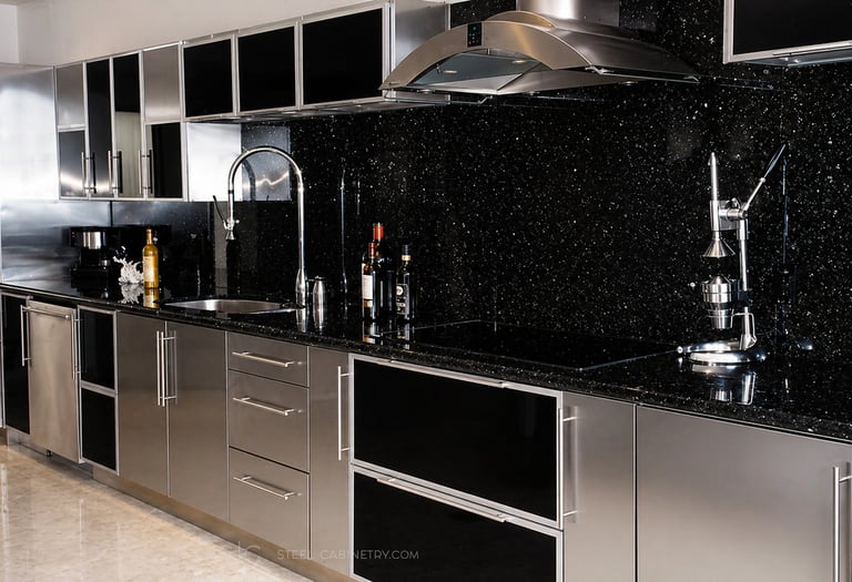 Luxury stainless steel kitchen cabinets combining brushed metal surfaces with black high-gloss panels.