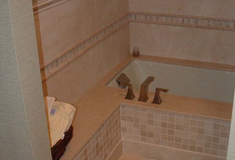 Custom tile installation around shower walls and bathroom flooring in Lake Forest IL.