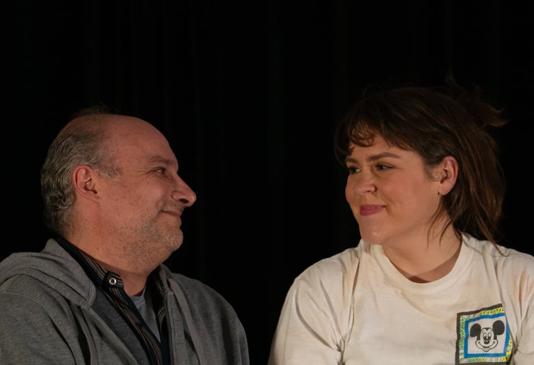 Man and woman smiling at each other.