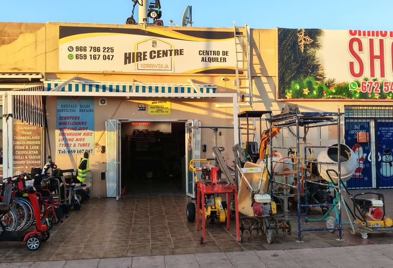 Hire Centre Torrevieja storefront featuring mobility scooters and construction equipment rentals.