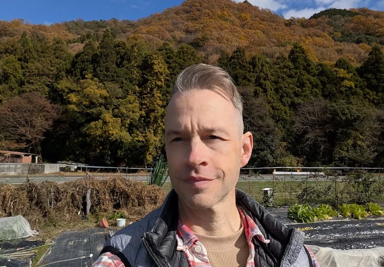 man standing in garden