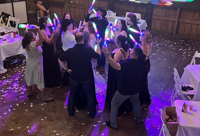people dancing with lighted foam toys