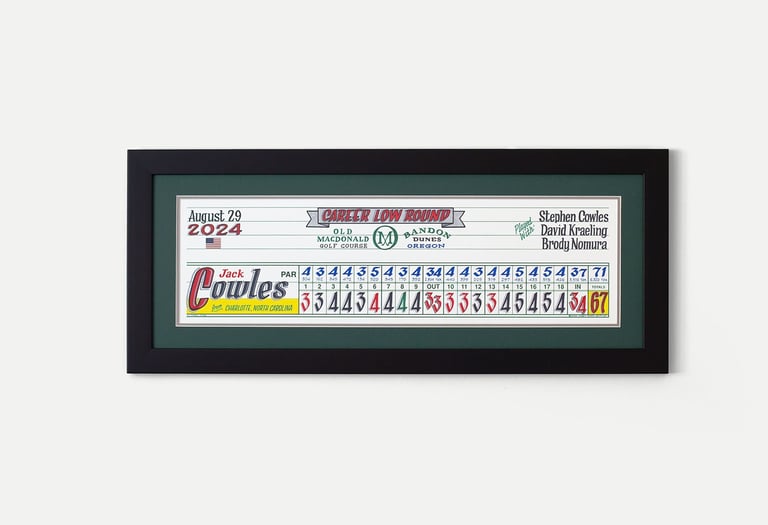 A framed piece of scorecard artwork for Jack Cowles who shot his career low round at Bandon Dunes.