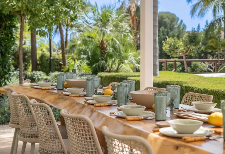 Al fresco dining terrace with wicker chairs at Villa Serenity