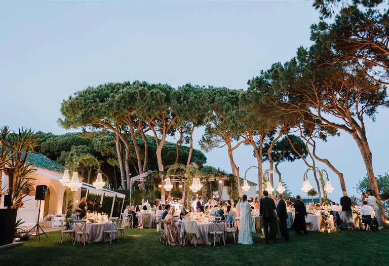 Evening gala dinner under chandeliers by the sea