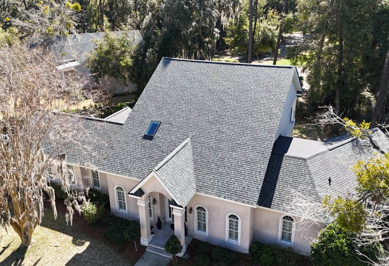 a house with a roof that has a roof that is covered in black