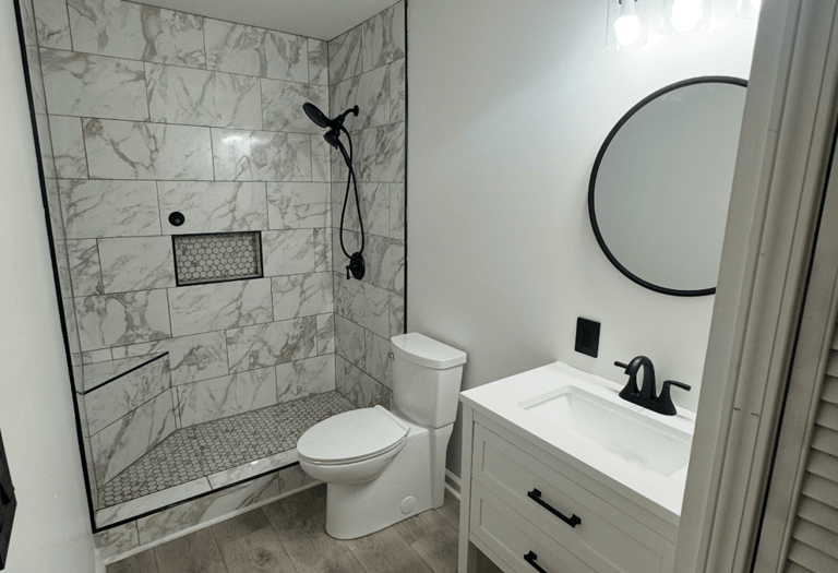 a bathroom with a marble shower and a marble shower