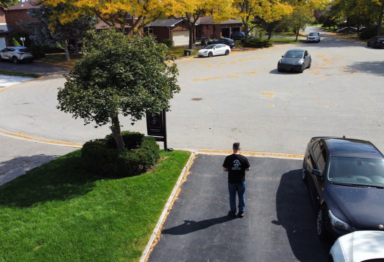 Drone driveway picture overlooking suburban housing
