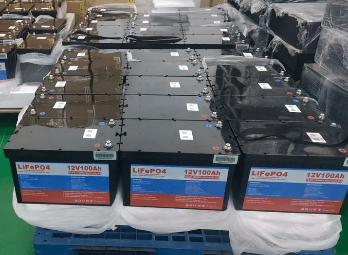 multiple 12 volt 100Ah lithium batteries stacked together in the manufacturing plant