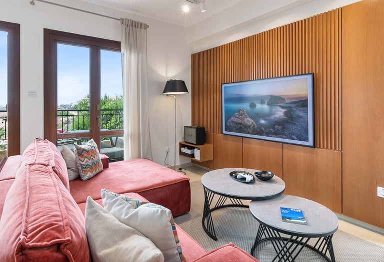 Sofa seating area with large TV and entertainment options at Theseus Retreat holiday rental in Cyprus