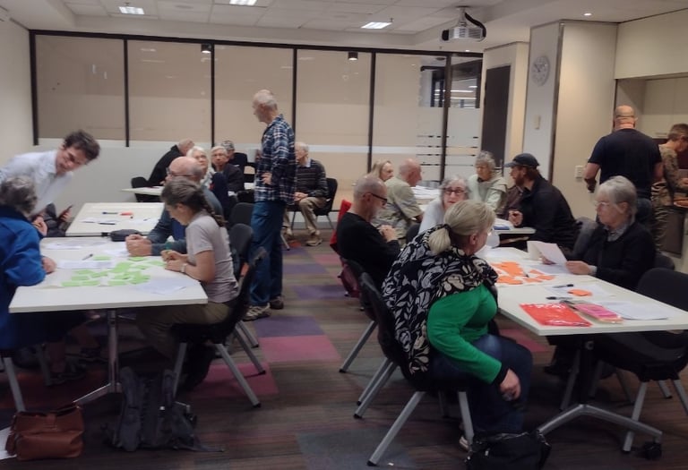Groups of people at tables in a room