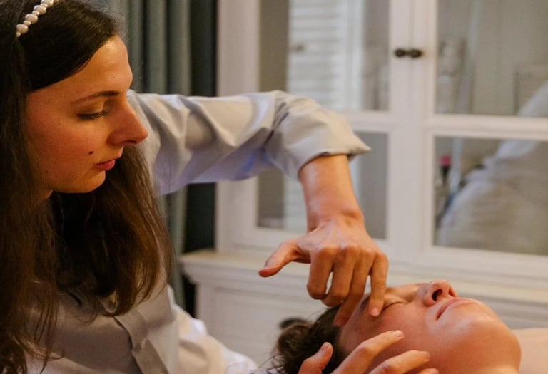 a woman giving a face massage 