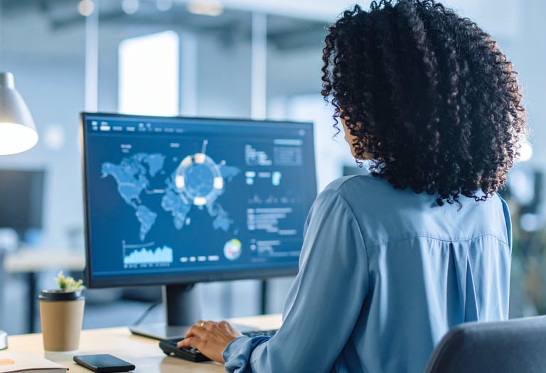 Business Change and AI—professional woman reviewing templates and tutorials on a laptop