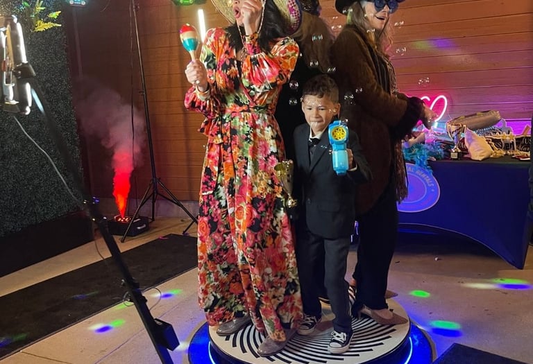 Family on a 360 video booth having fun