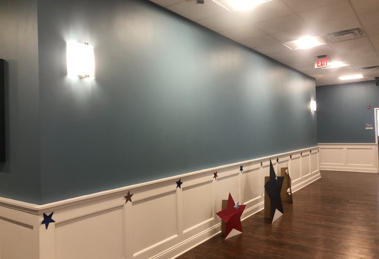 Lobby wall before bespoke mural by Marcine at Mount Bethel Village in Warren, NJ