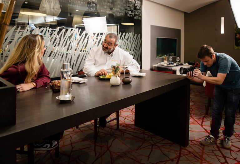a man and woman are sitting at a table
