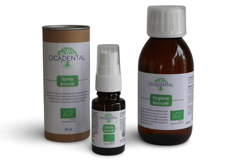 Cicadental organic oral care products including natural buccal spray and mouthwash bottles.