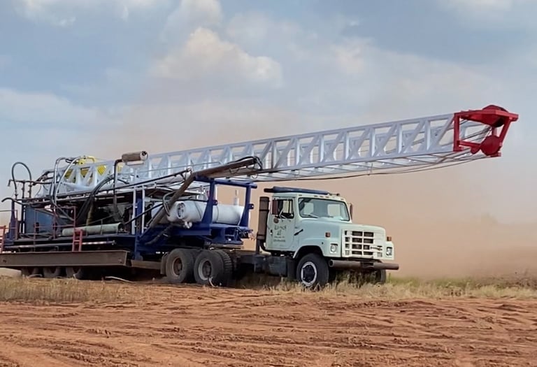 Phillips Drilling truck pulling drilling rig