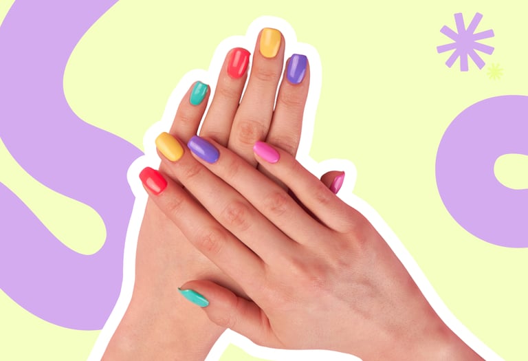 Hands with colorful rainbow manicured nails on a vibrant yellow and purple background.