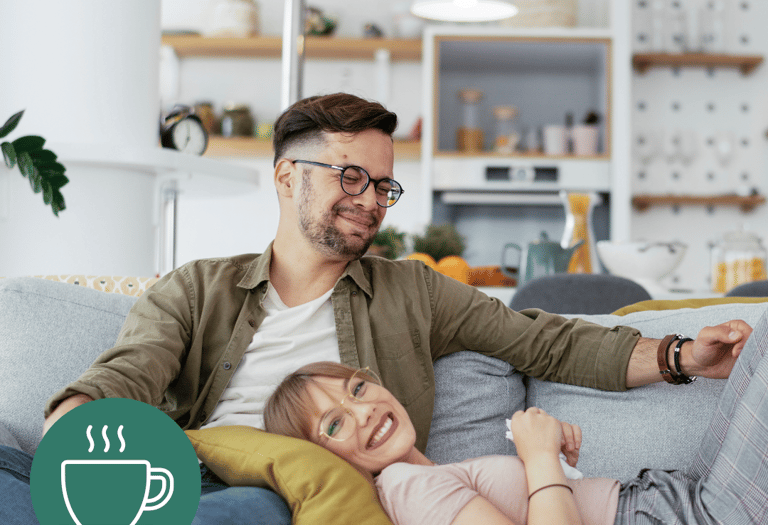 a man and woman sitting on a couch