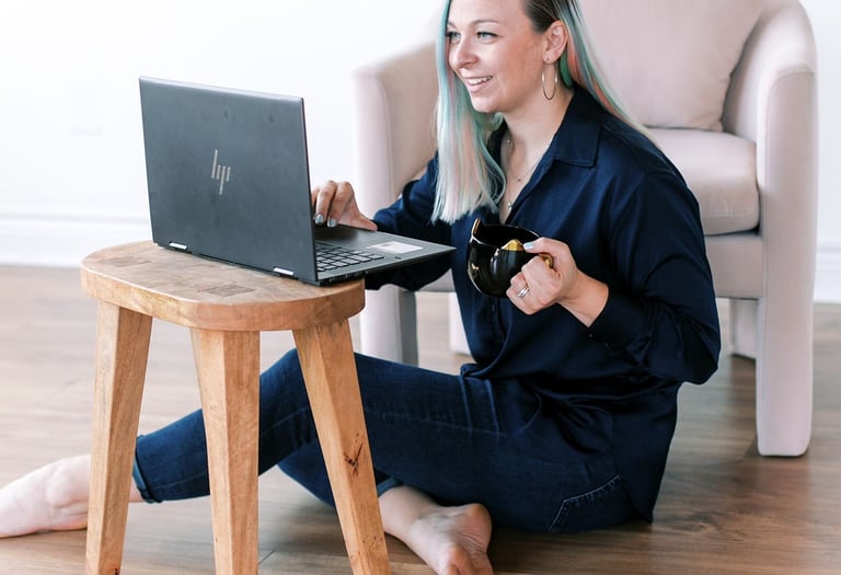 Tabitha with butterfly effect consulting on her laptop talking to a client