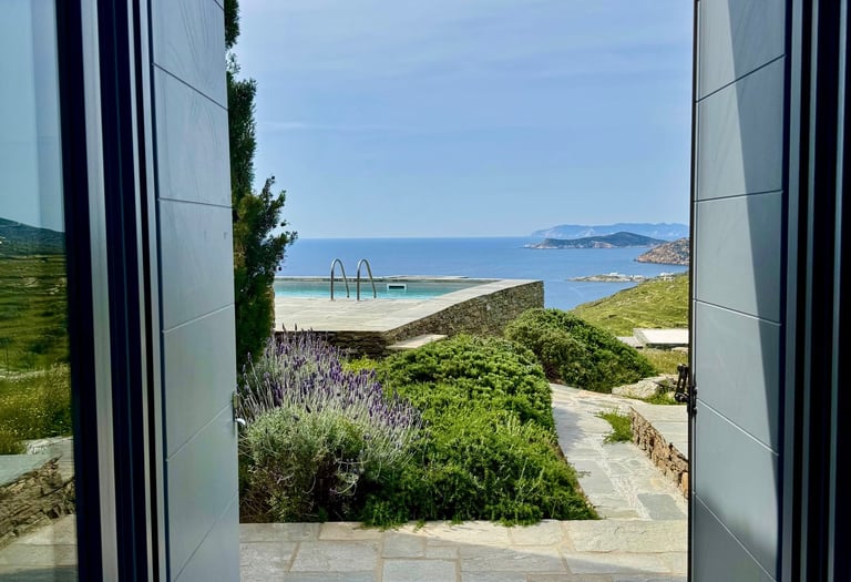 View out of one of the bedrooms over the pool onto the sea