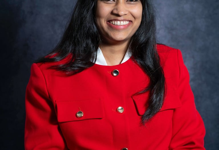 a woman in a red coat and jeans