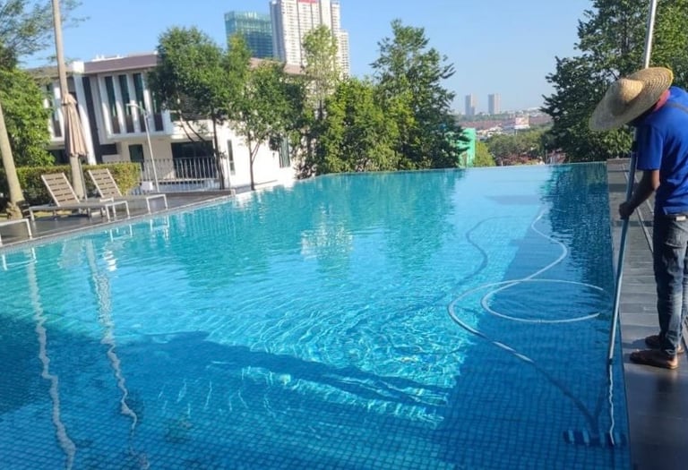 Crystal-clear swimming pool cleaning by TOT Cleaning & Landscape Sdn Bhd.