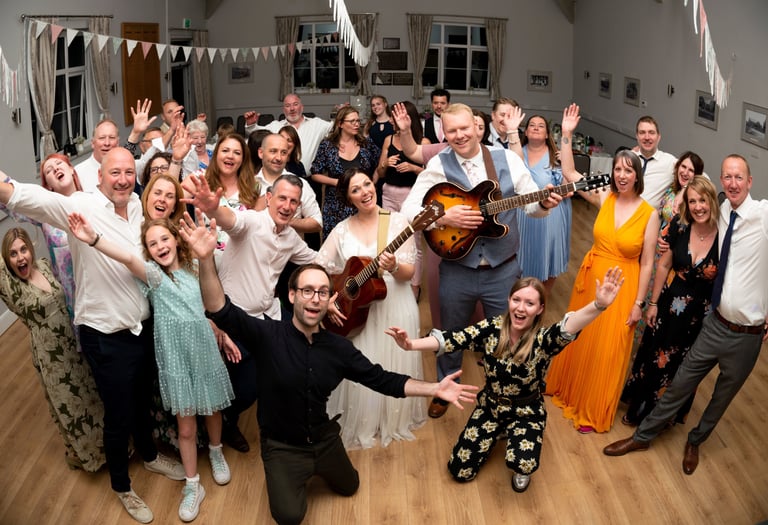 Wedding musicians having fun party with bride and groom