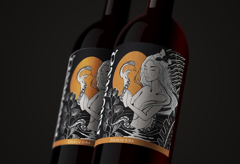 Two dark bottles of Žolelių Gira featuring artistic black and gold labels with a woman and snake illustration.