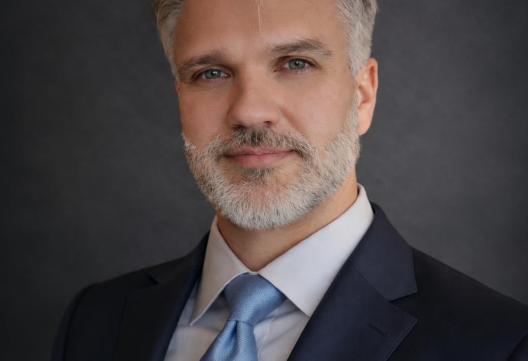 a man in a suit and tie with a blue tie Karolis Suminas