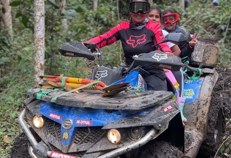 a man and a woman riding on a four wheeler atv