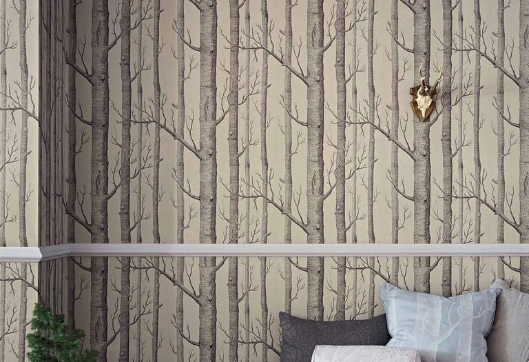 Rustic room featuring birch tree forest wallpaper with a daybed, fur rug, and gold deer head wall decor.