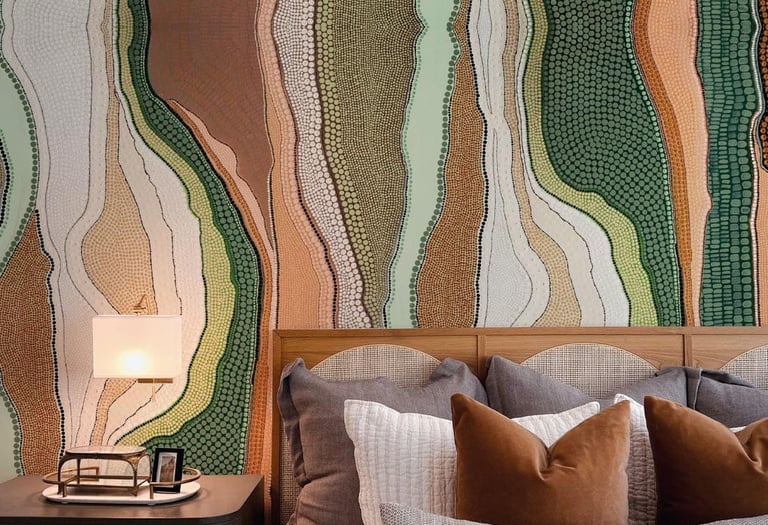 Modern bedroom featuring an earthy Aboriginal dot art wallpaper behind a wooden headboard with neutral bedding.
