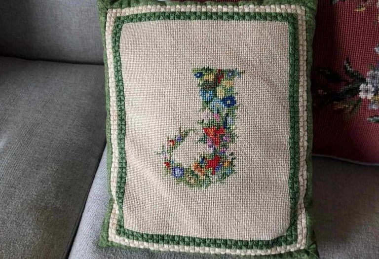 vintage needlework monogram turned into decorative pillow