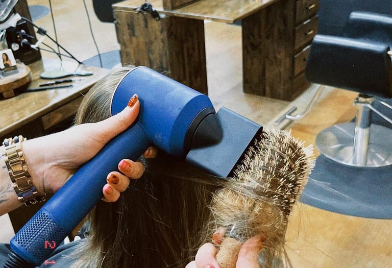blow drying with Dyson dryer at Meraki and Co salon and spa greer sc 