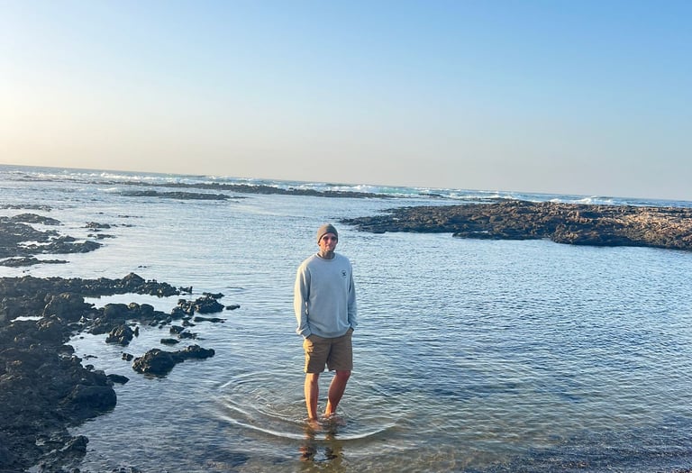 Seamusthefreenomad standing in the sea at the beach