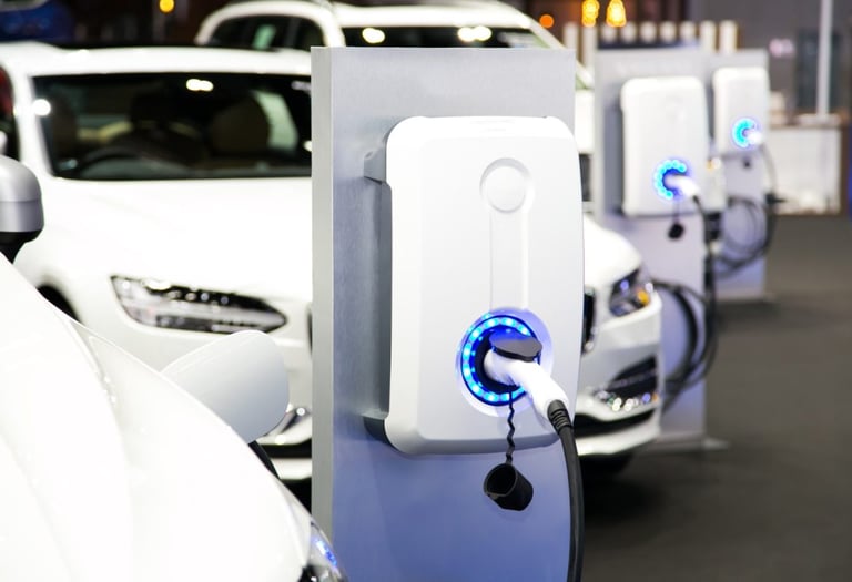 a row of electric cars parked in a row