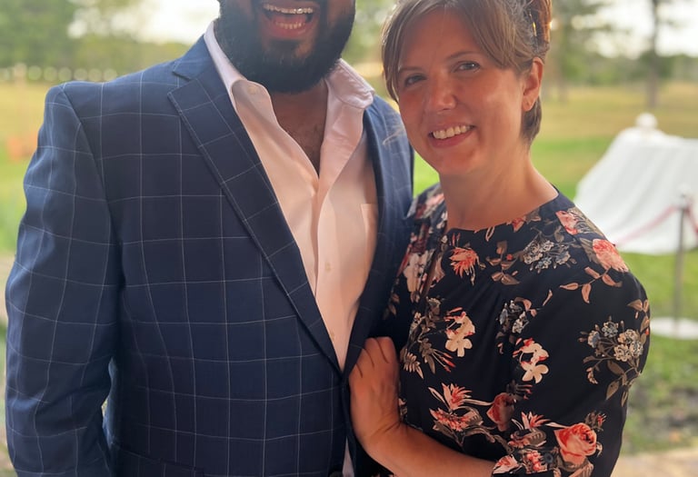 a man and woman standing next to each other