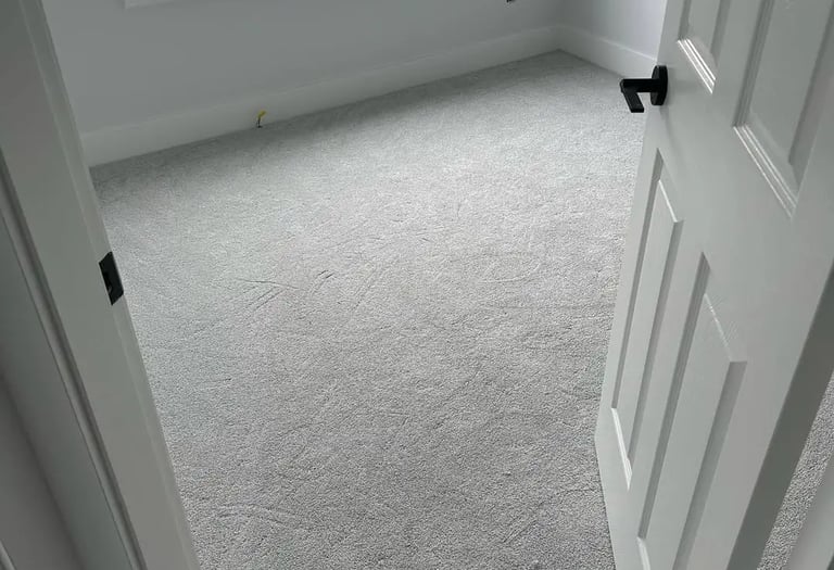 Home carpet samples – soft light grey bedroom carpet installation by Master Carpet London Ontario, perfect for modern homes.