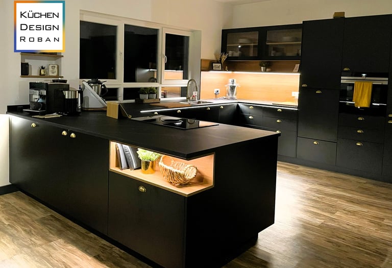 a kitchen with a black counter top and a kitchen island