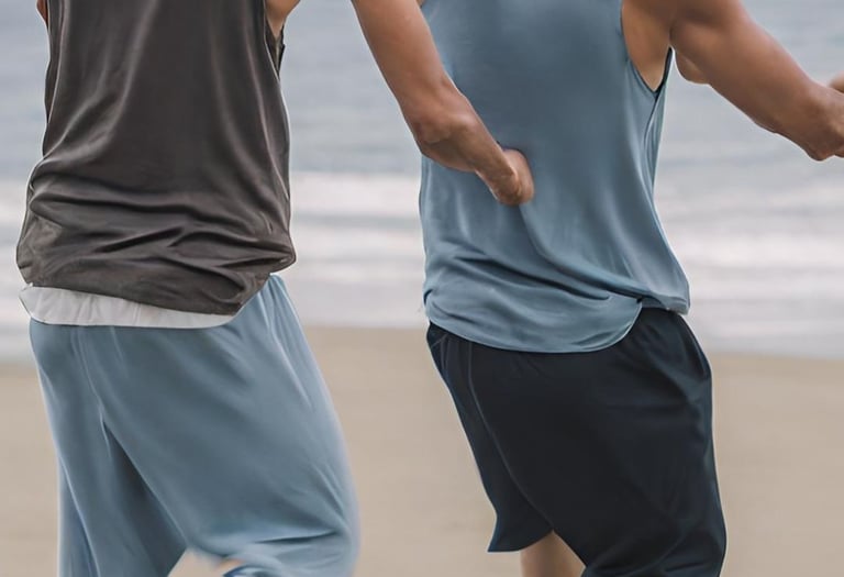 Two men dancing on the beach together
