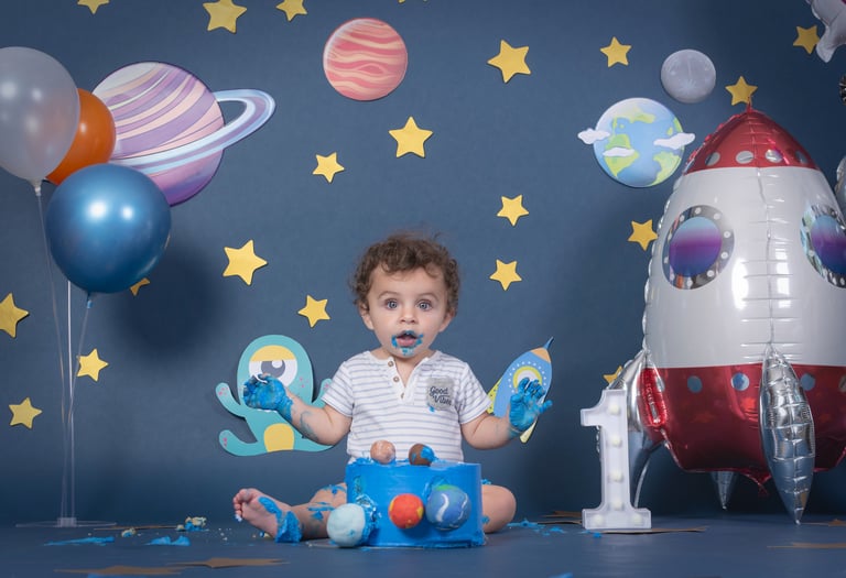 a baby boy in a space themed photo shoot
